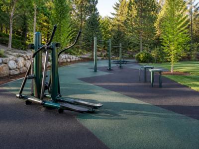 Rubber surfacing under an outdoor fitness circuit